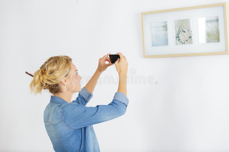 Woman standing in art museum near paintings royalty free stock photo Woman standing in art museum near paintings royalty free stock photo