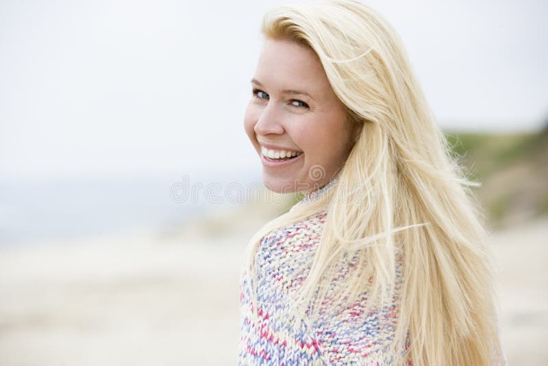 Woman standing at beach stock image Woman standing at beach stock image