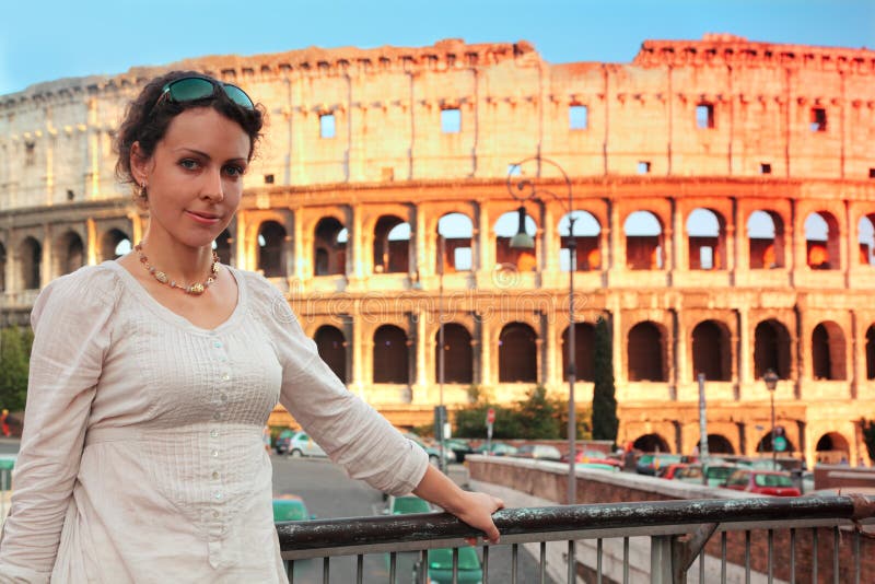 Woman standing on bridge near Colosseum