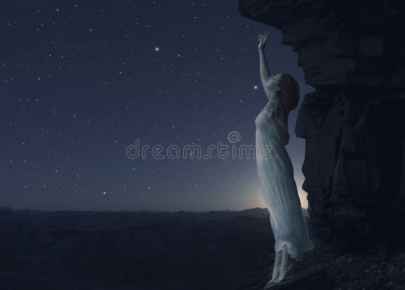 Woman standing on cliff s edge of another planet.