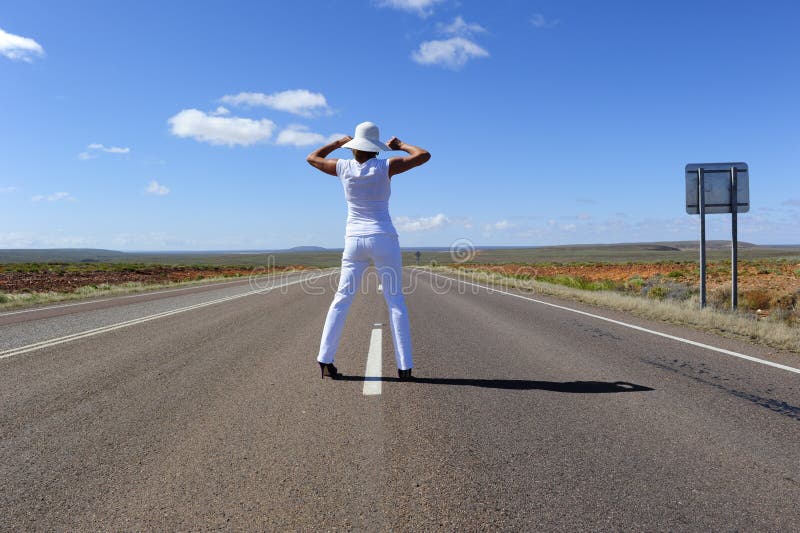 Woman Standing on Highway