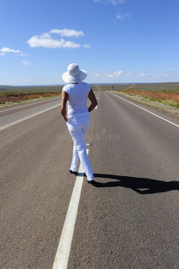 Woman Standing on Highway