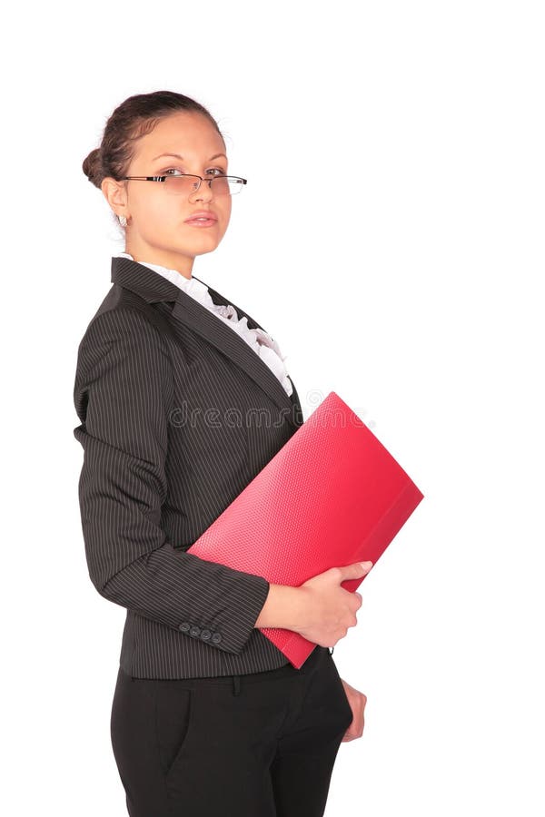 Woman stands with red folder in hand