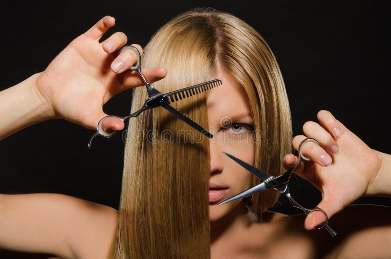 Woman with straight hair and scissors