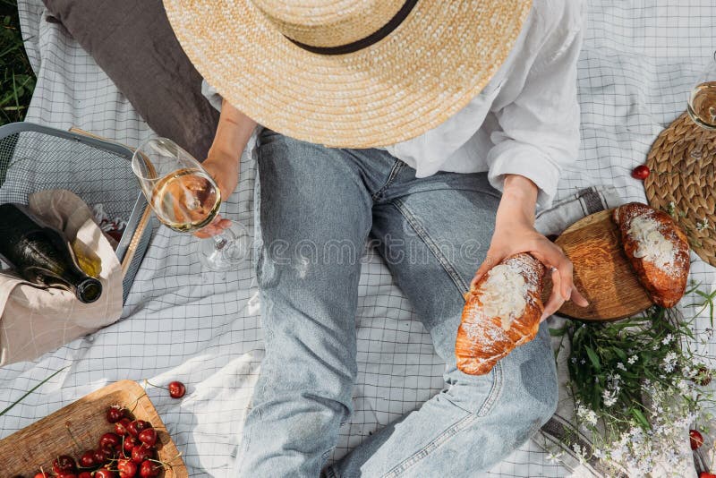 Aesthetic picnic outdoors with wine glasses bread berries and flowers.  Rustic picnic with neutral tones colours. Stock Photo by  ©lamapacas.gmail.com 378791178