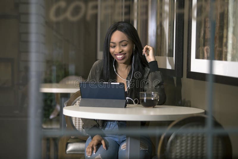 Woman Streaming Videos on a Tablet in a Coffeeshop Stock Photo - Image ...