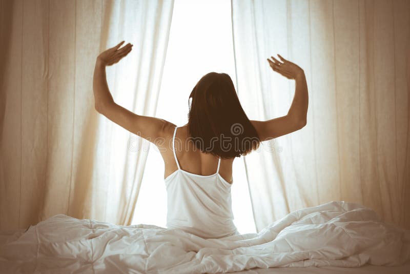 Woman Stretching Hands In Bed After Wake Up Sun Flare Brunette 