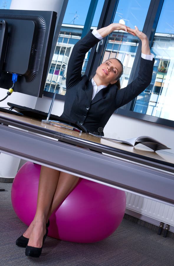 Woman stretching in office stock photo. Image of lady 20948554