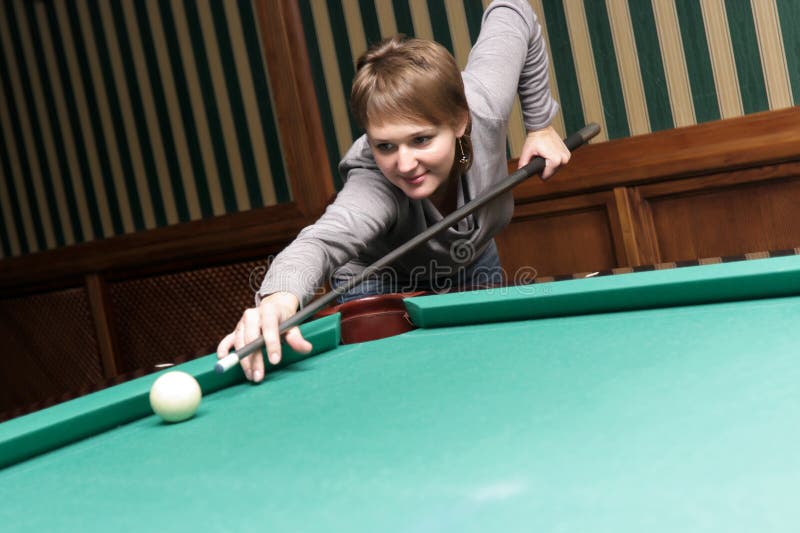 Woman Strikes Billiard Ball Stock Photo Image of females, aiming 6935138