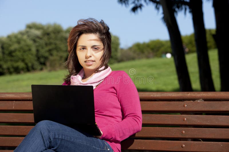 Woman studying with a laptop