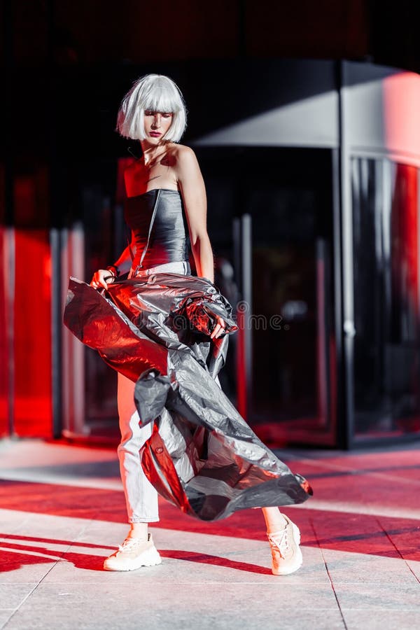 Premium Photo  Fashion of the future futuristic blonde in red space high  quality photo