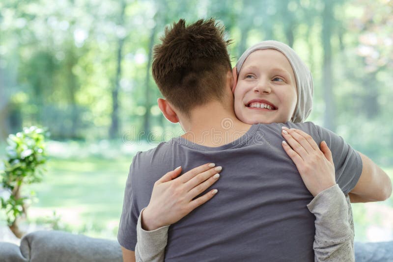 Young happy women hugging her husband after successful therapy. Young happy women hugging her husband after successful therapy