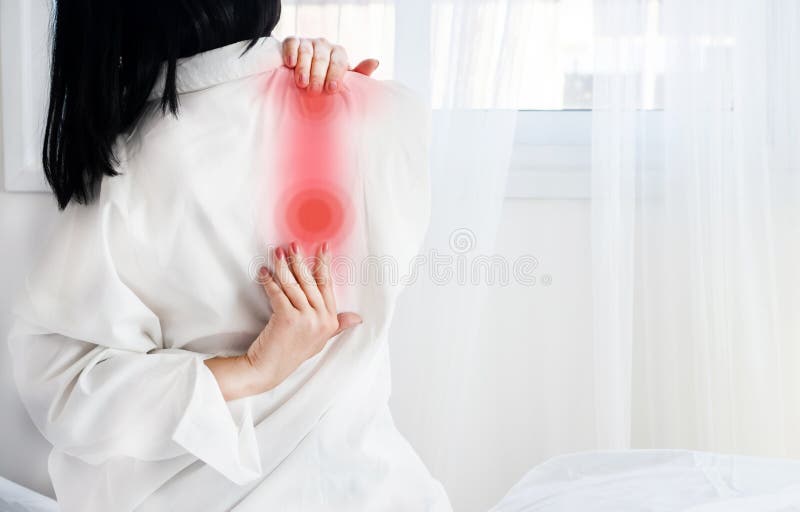 Woman Suffering from Shoulder Blade Pain after Sleeping on it Wrong