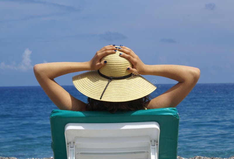 Woman Sunbathing in a Plastic Chair on a Beautiful Stock Image Image