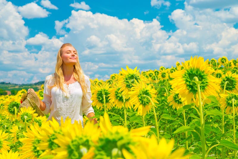 Woman in sunflower field