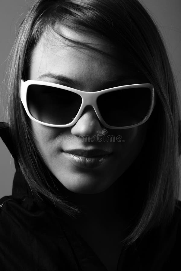 Woman in sunglasses. Fashion bw portrait.