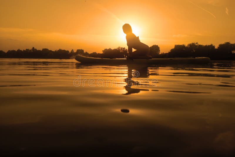 Woman on Sup Board, Paddle Boarding at Sunset Reflection Stock Image ...