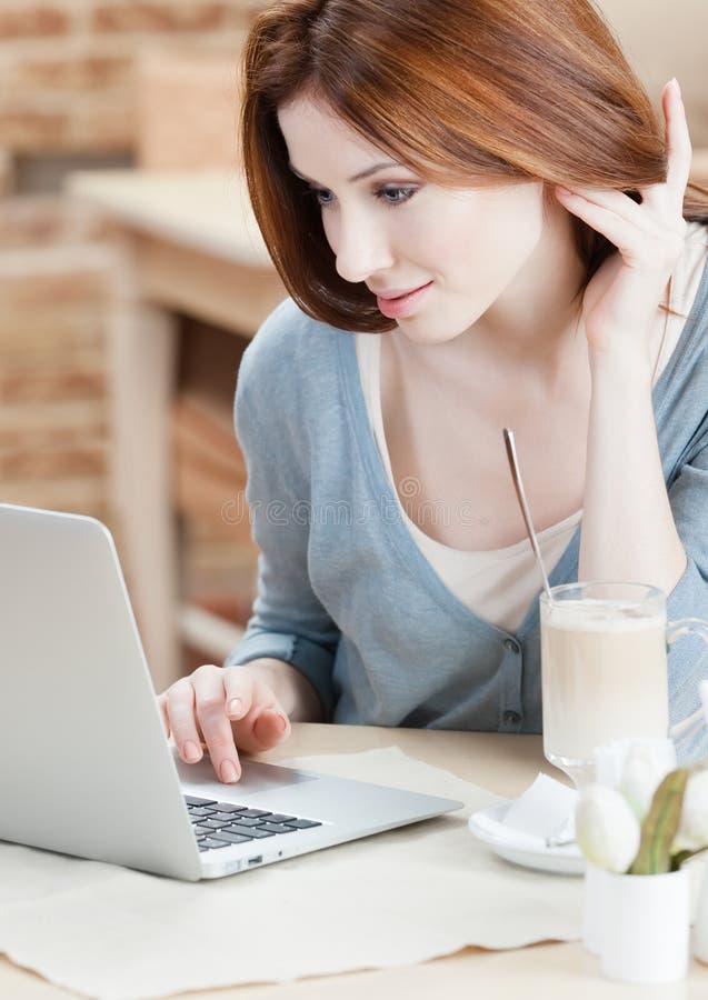 Woman is surfing on the internet on the laptop royalty free stock photos Woman is surfing on the internet on the laptop royalty free stock photos