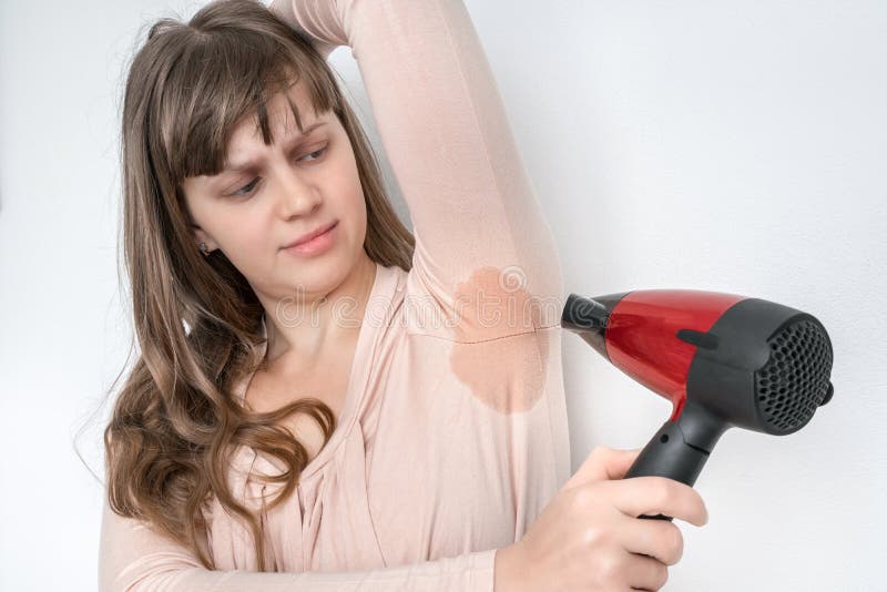 Woman is Drying Her Sweating Armpit with Hair Dryer Stock Photo - Image of  body, armpits: 206749722