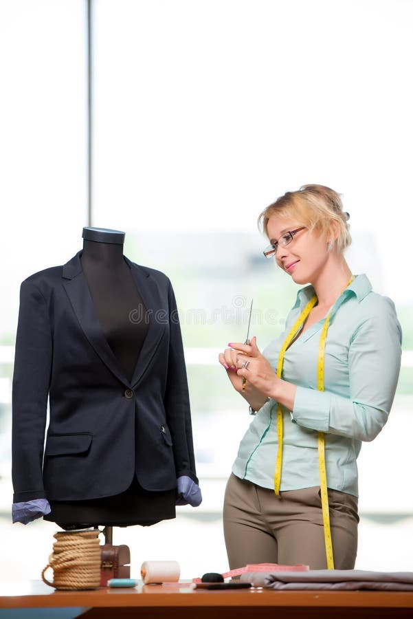 The woman tailor working on new clothing