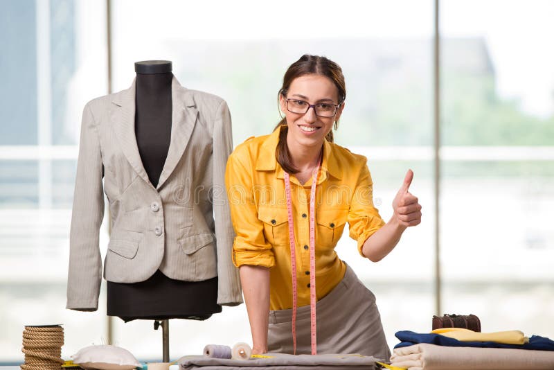 The woman tailor working on new clothing