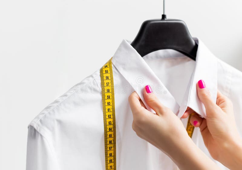 Woman tailoring business shirt stock image Woman tailoring business shirt stock image