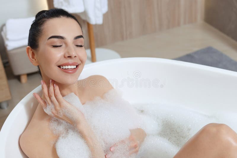 Woman Taking Bath with Shower Gel Indoors Stock Photo Image of person, bathroom 248313768