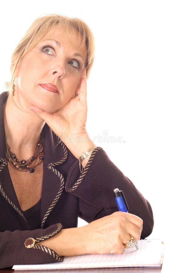 Woman taking notes thinking