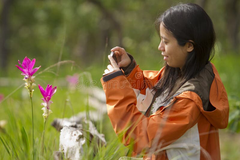 Woman taking a tulip photo