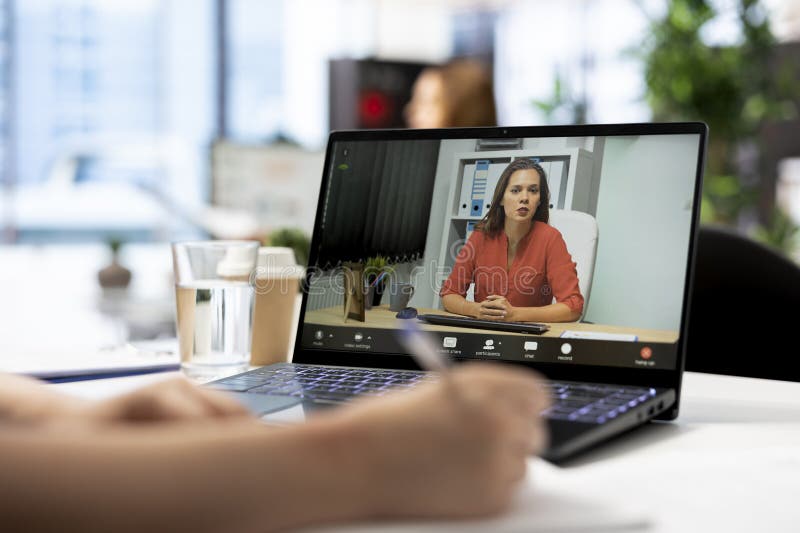 Woman talking with recruiter during remote videocall on notebook royalty free stock photography