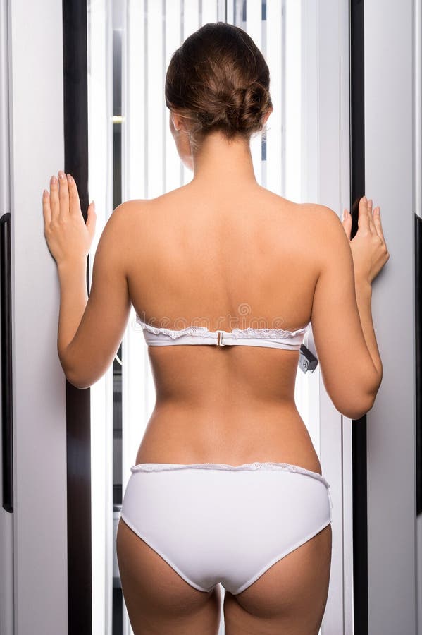 Download Woman In Tanning Booth. Royalty Free Stock Images - Image ...