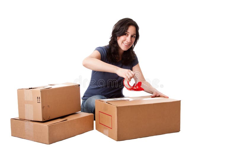 Woman taping moving storage boxes royalty free stock photography