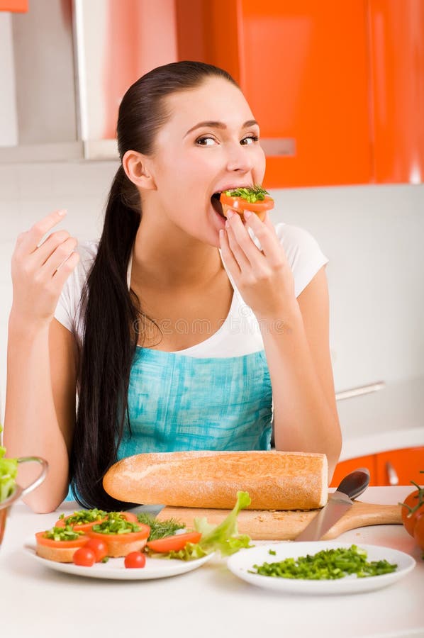 Woman tasting fresh healthy sandwiches