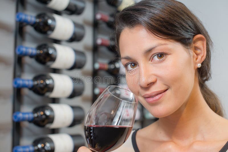 Woman tasting some wine royalty free stock photography Woman tasting some wine royalty free stock photography