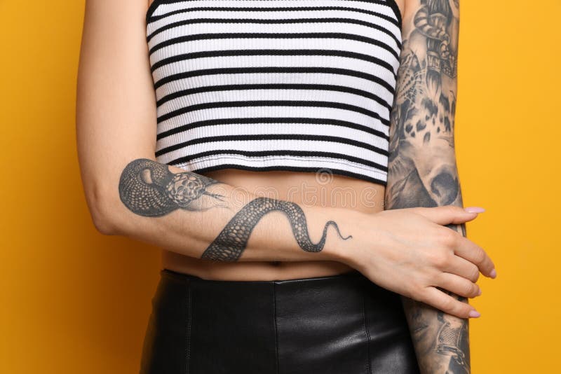 Snake bracelet tattoo on the left upper arm
