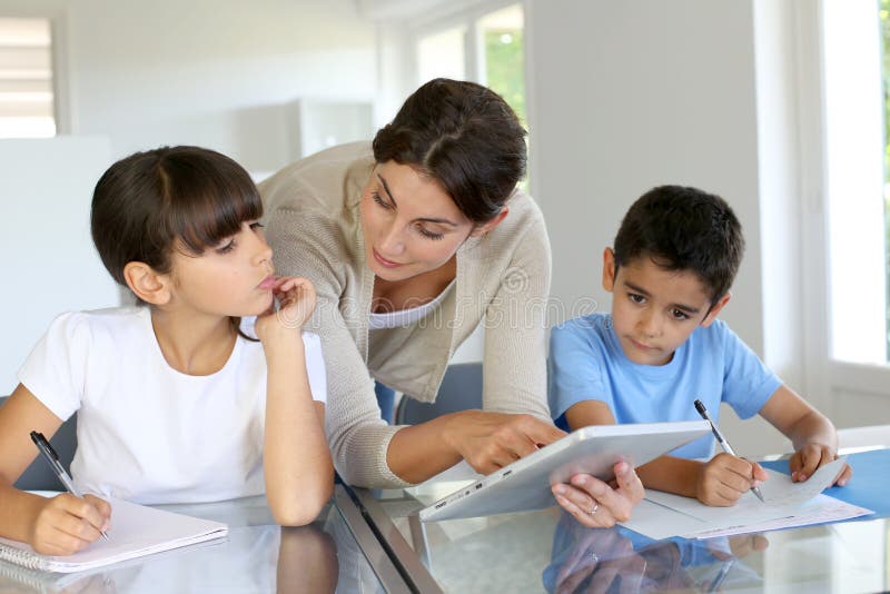 Woman teaching children at school royalty free stock photography Woman teaching children at school royalty free stock photography