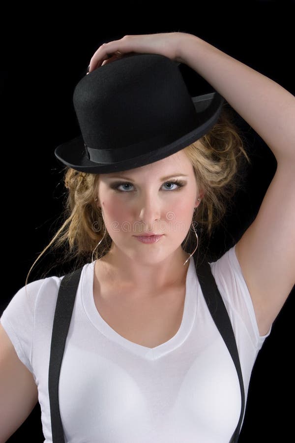 Woman in tee shirt and black hat