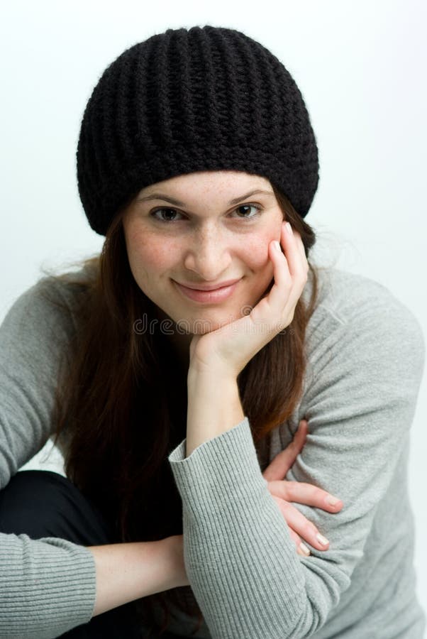 Woman, or teen in fall or winter hat.