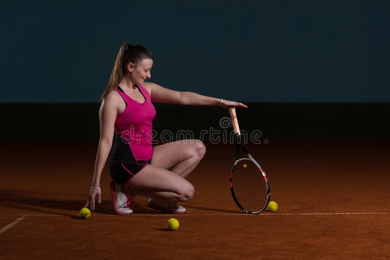 Woman With Tennis Racket And Tennis Balls. Paddle, indoor.