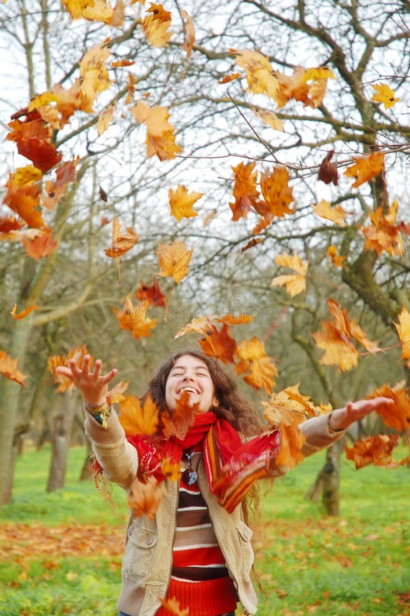 Woman throwing leaves