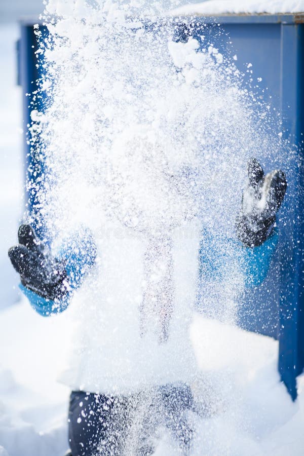 Woman throwing snow stock image. Image of hand, clothing 26567385