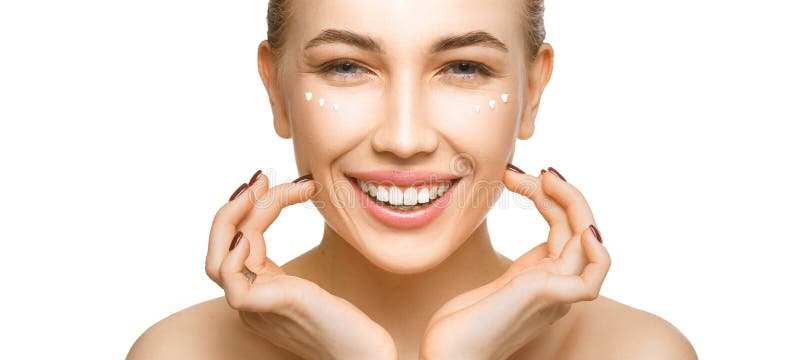 Woman touching her face by hands. Applying cream on a perfect smooth soft skin. royalty free stock image Woman touching her face by hands. Applying cream on a perfect smooth soft skin. royalty free stock image