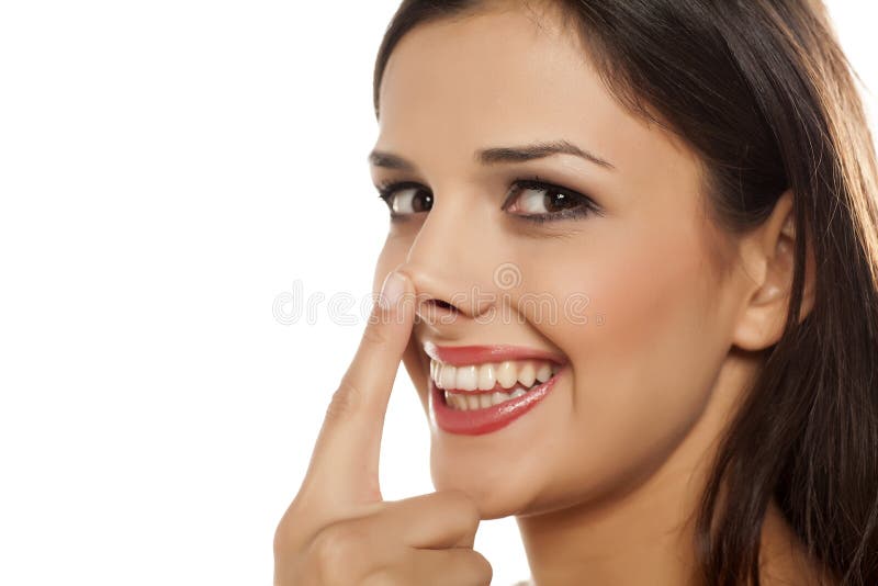 Woman touching her nose stock photo. Image of woman, young 86076838