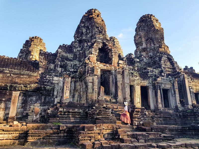 Woman tourist in Bayon temple in Angkor Wat stock image Woman tourist in Bayon temple in Angkor Wat stock image