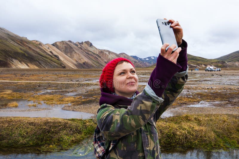 Woman tourist taking selfie photo in Iceland