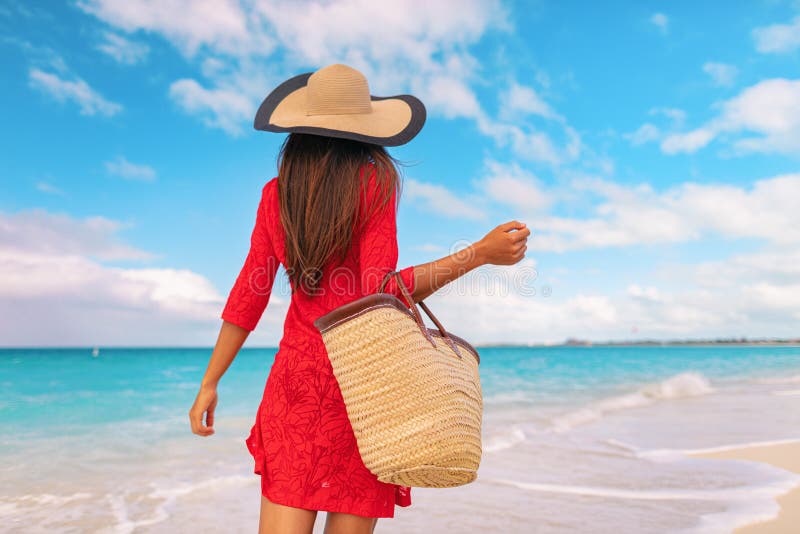 Woman Tourist Walking on Tropical Summer Vacation Wearing Sun Hat, Red  Dress and Beach Bag Relaxing on Travel Holidays Stock Photo - Image of  guadeloupe, holiday: 199631712