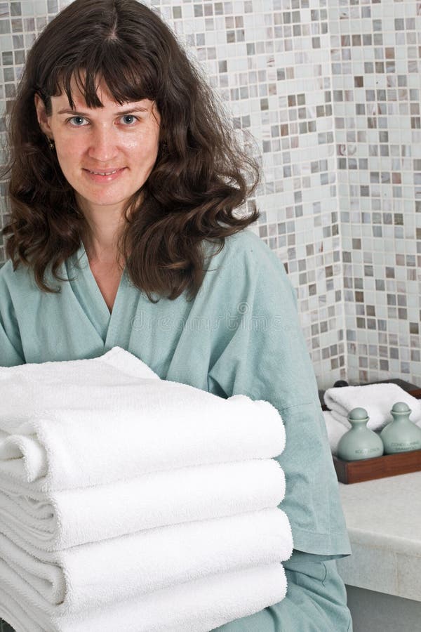Woman with towel in spa salon. royalty free stock photography