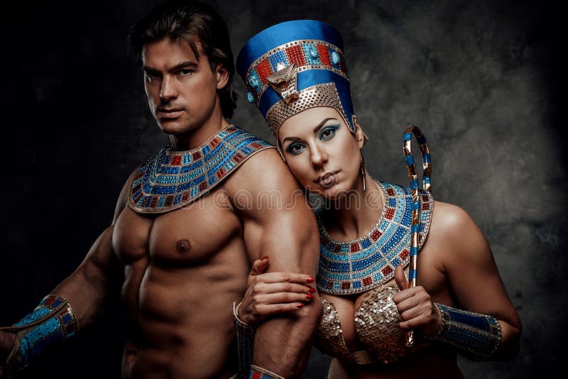 Attractive couple dressed up in traditional egyptian costumes, standing very close to each other