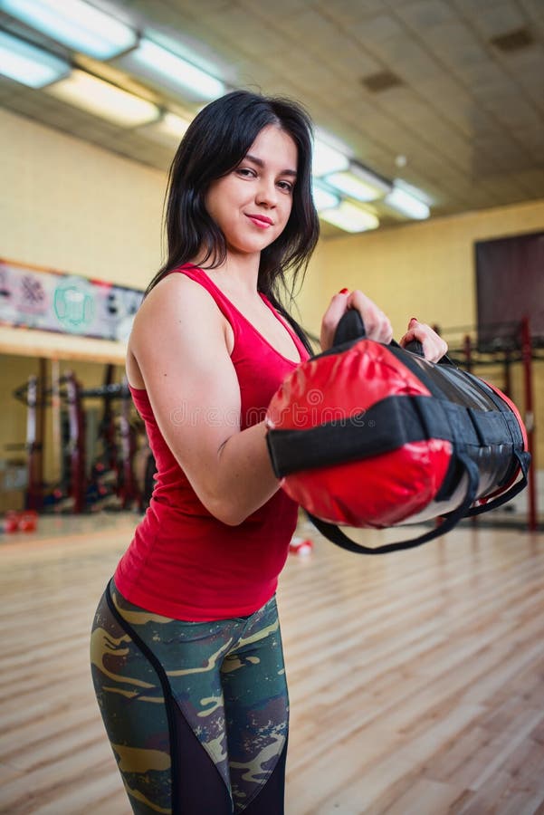Woman Training Biceps Muscle with Heavy Bag Stock Photo Image of