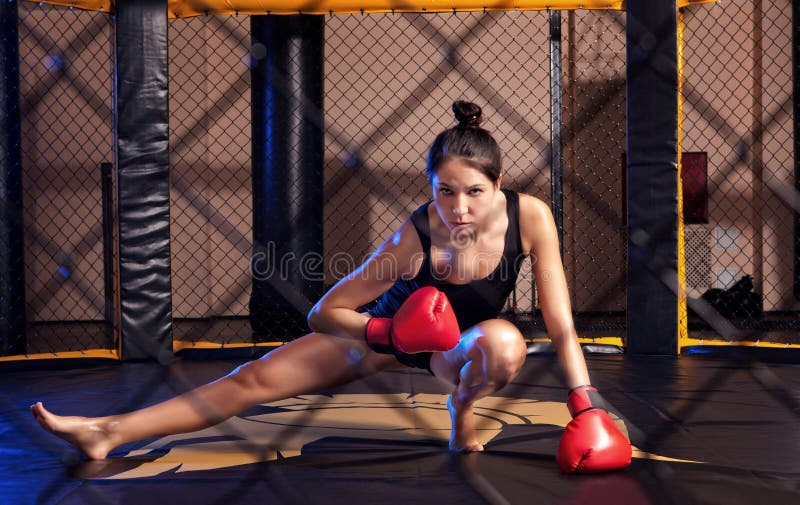 Woman training gym boxing mma ring